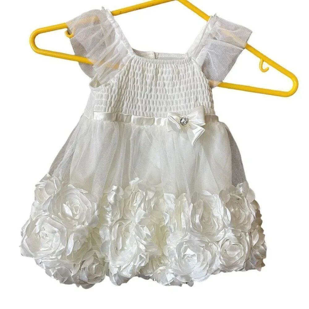 Two 18M dresses by OshKosh and Nannette baby.